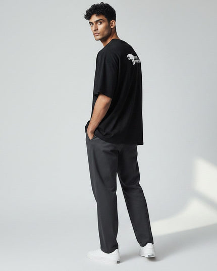 Black 100% cotton t-shirt with white Gym Panthers logo on the back, designed for performance and everyday wear.