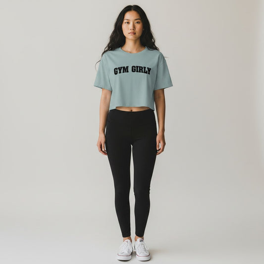 GYM PANTHERS light blue cotton blend crop top with black 'Gym Girly' text graphic. Relaxed fit, short sleeves.