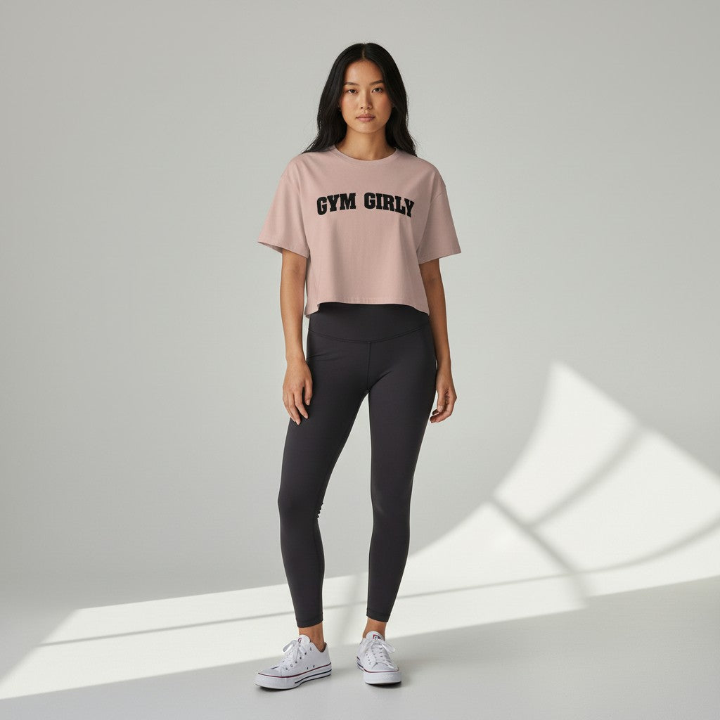 GYM PANTHERS dusty rose pink cotton blend cropped t-shirt with black 'Gym Girly' text graphic.