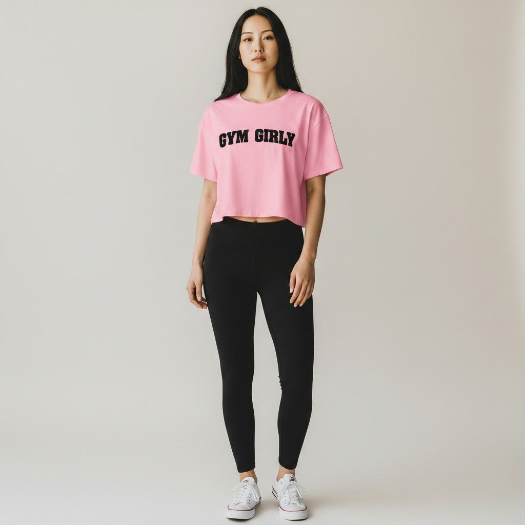 GYM PANTHERS pink cotton crop top with black 'Gym Girly' text, short sleeves, crew neck, relaxed fit.