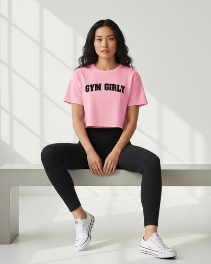 GYM PANTHERS pink cotton crop top with black 'Gym Girly' text, short sleeves, and relaxed fit.
