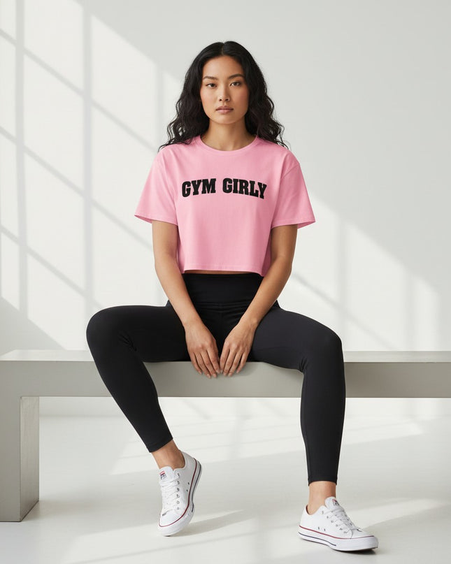 GYM PANTHERS pink cotton crop top with black 'Gym Girly' text, short sleeves, and relaxed fit.