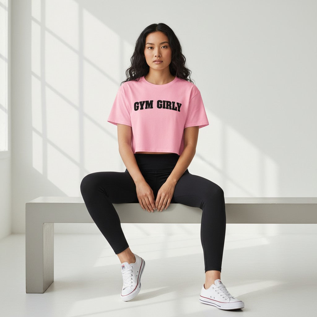 GYM PANTHERS pink cotton crop top with black 'Gym Girly' text, short sleeves, and relaxed fit.