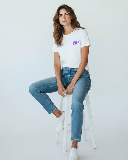 GYM PANTHERS white 100% cotton t-shirt with a small purple and blue logo on the left chest. Model wears it with blue jeans.