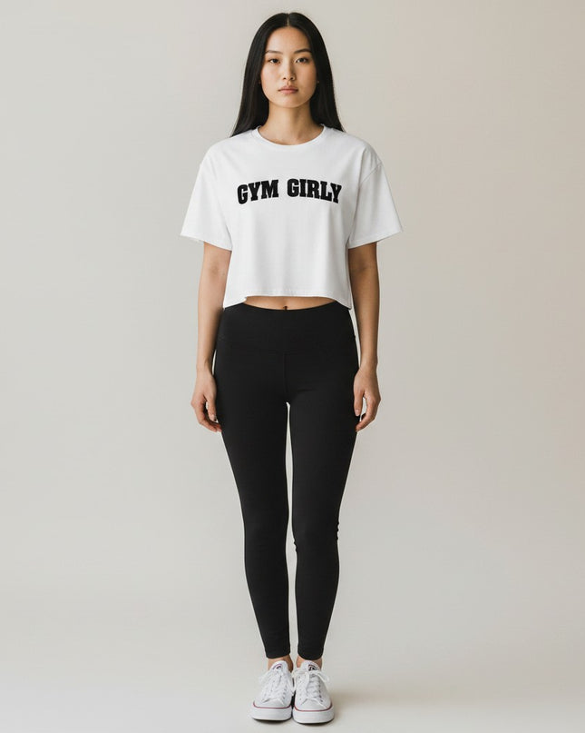 GYM PANTHERS white cotton crop top with black "Gym Girly" text, relaxed fit, short sleeves.